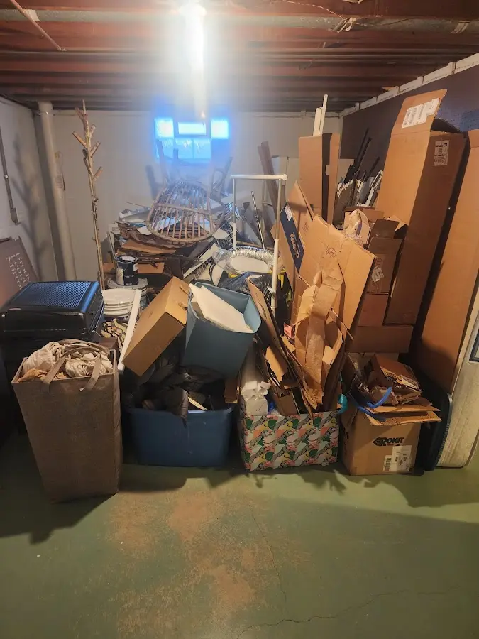 Roll-off dumpster container at job site for 2 Yard Dumpster Rental in Granville